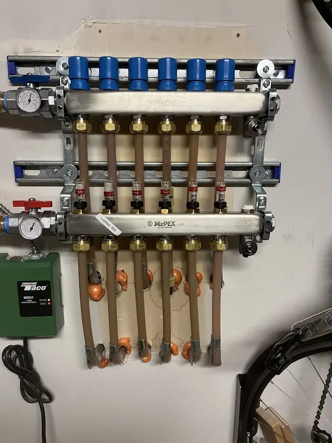 Plumber performing Water Heater Repair at a residential property in Suffield